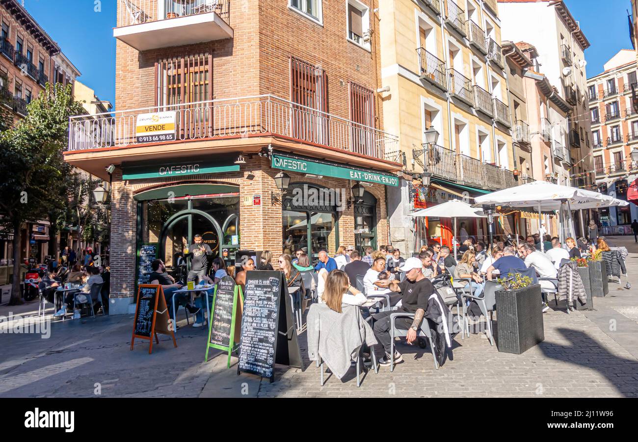 Cafestic outdoor cafe, patrons people on terrace. Cafeteria in central Madrid, Spain Stock Photo
