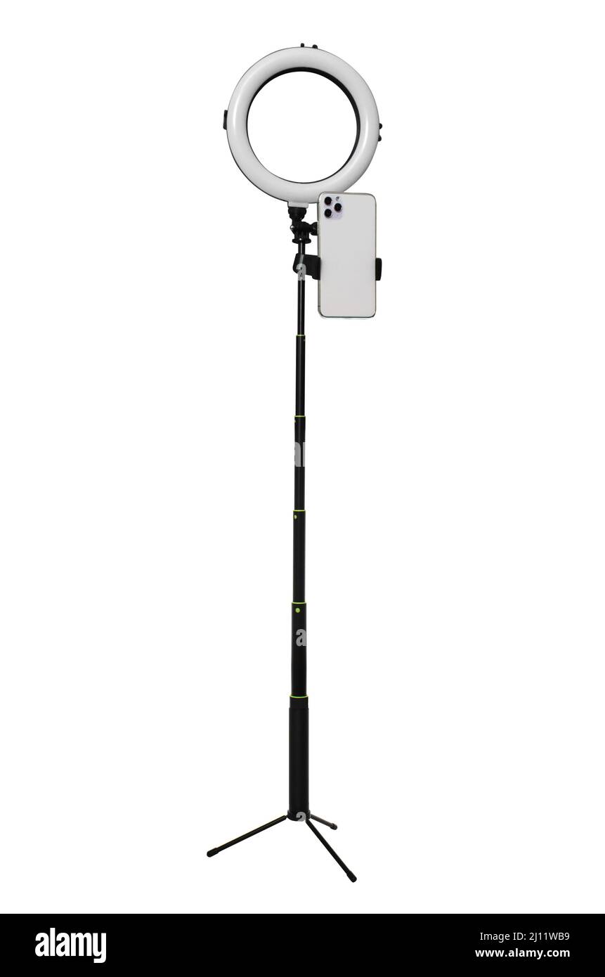 tripod with a lamp for a selfie on a white background in isolation Stock Photo