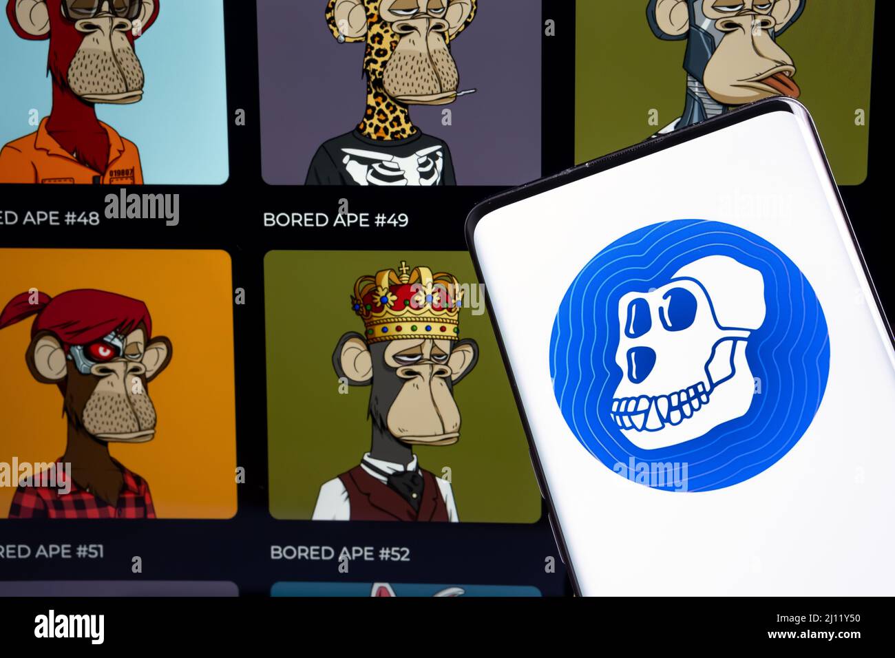 ApeCoin crypto token logo seen on the smartphone and blurred Bored Ape  Yacht Club NFT gallery on the background. Concept. Stafford, United  Kingdom, Ma Stock Photo - Alamy