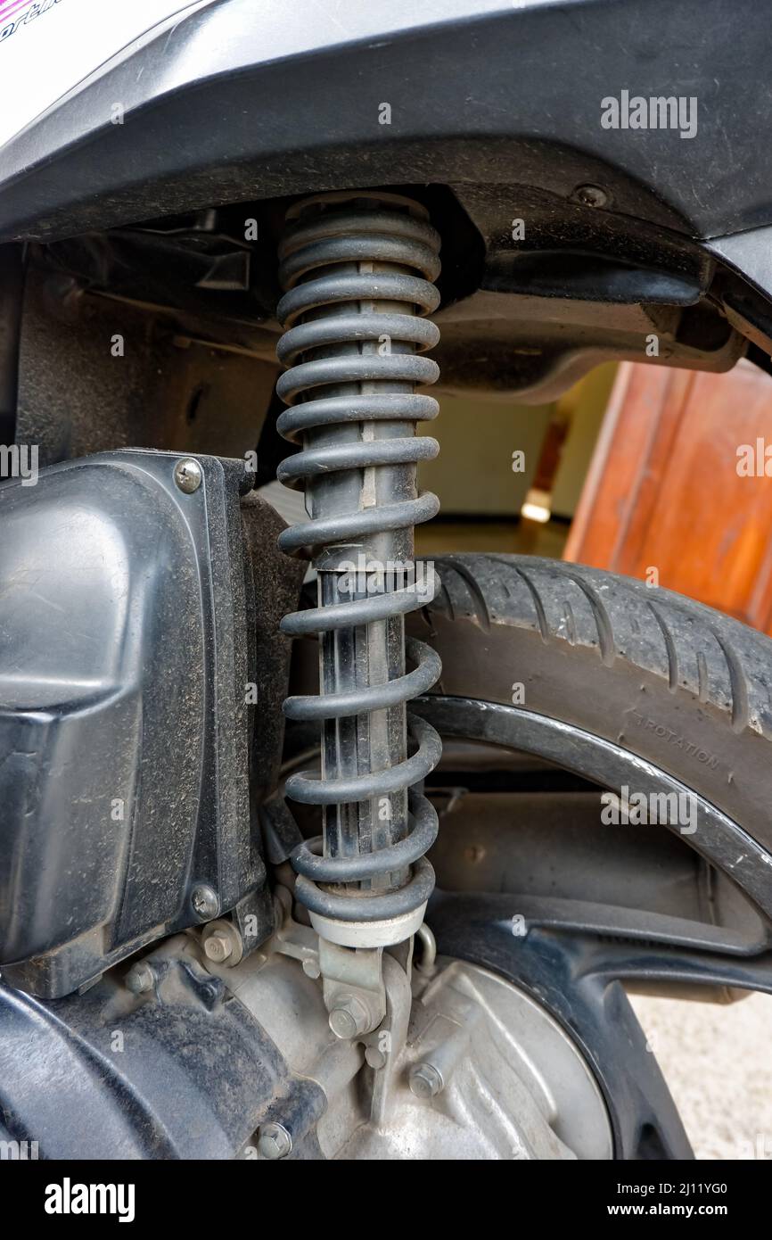 close up motorcycle black rear shock absorber suspension. dirty with clay  marks Stock Photo - Alamy