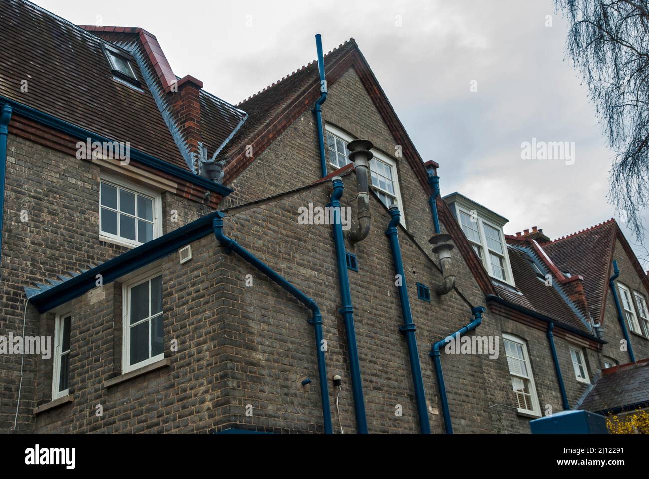 Gutters on side wall of old traditional British brick house Stock Photo
