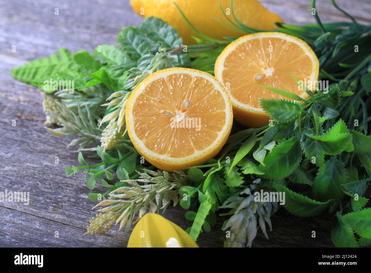 Organic lemons on wood background Stock Photo