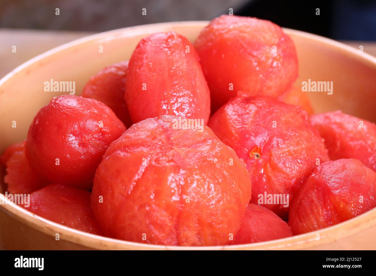 Whole peeled tomatoes in a bowl Stock Photo Alamy