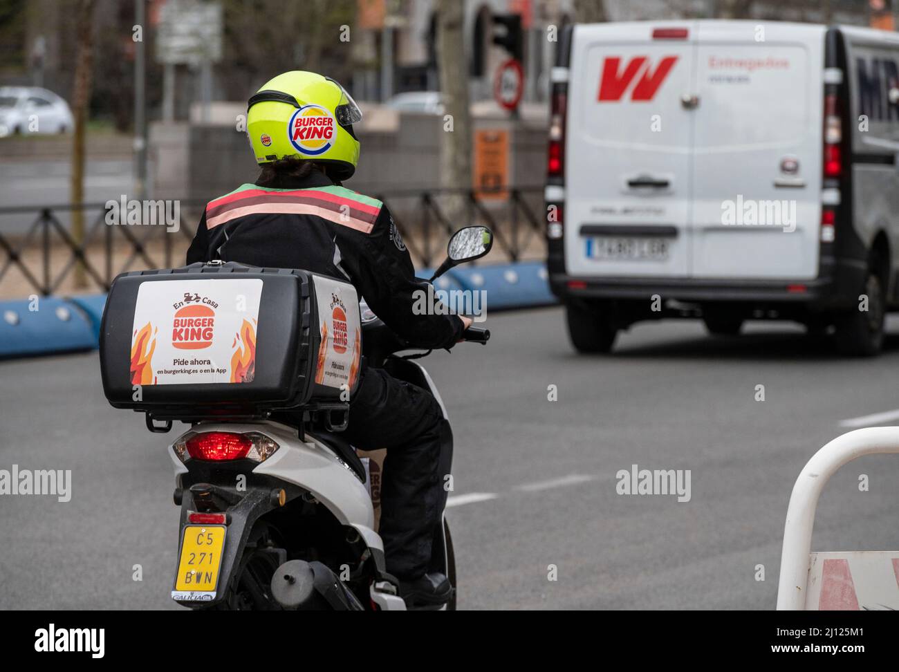 Madrid, Spain. 19th Mar, 2022. A delivery courier from the American chain of hamburger fast food restaurants Burger King rides a motorcycle in Spain. (Credit Image: © Xavi Lopez/SOPA Images via ZUMA Press Wire) Stock Photo