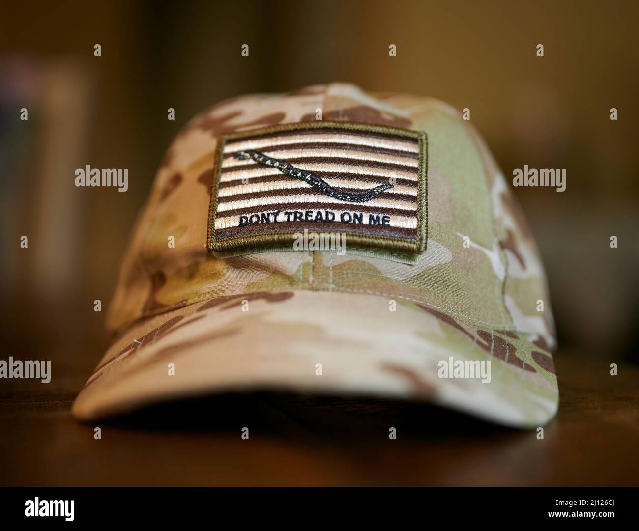 Don't Tread on Me, Gadsden Flag patch on a camo hat. Stock Photo