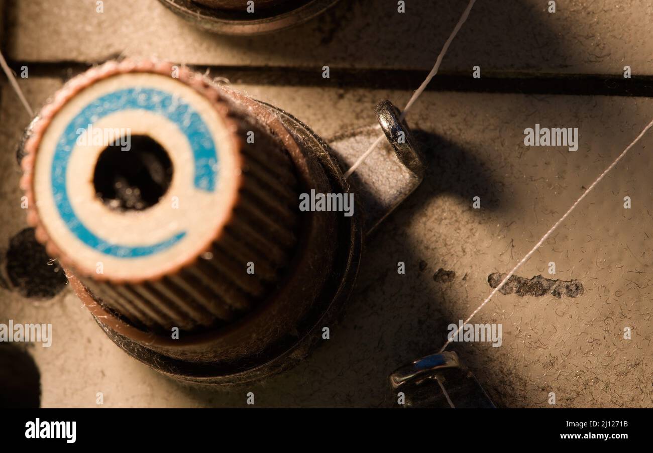 Industrial sewing machine's tension knob with threads Stock Photo Alamy