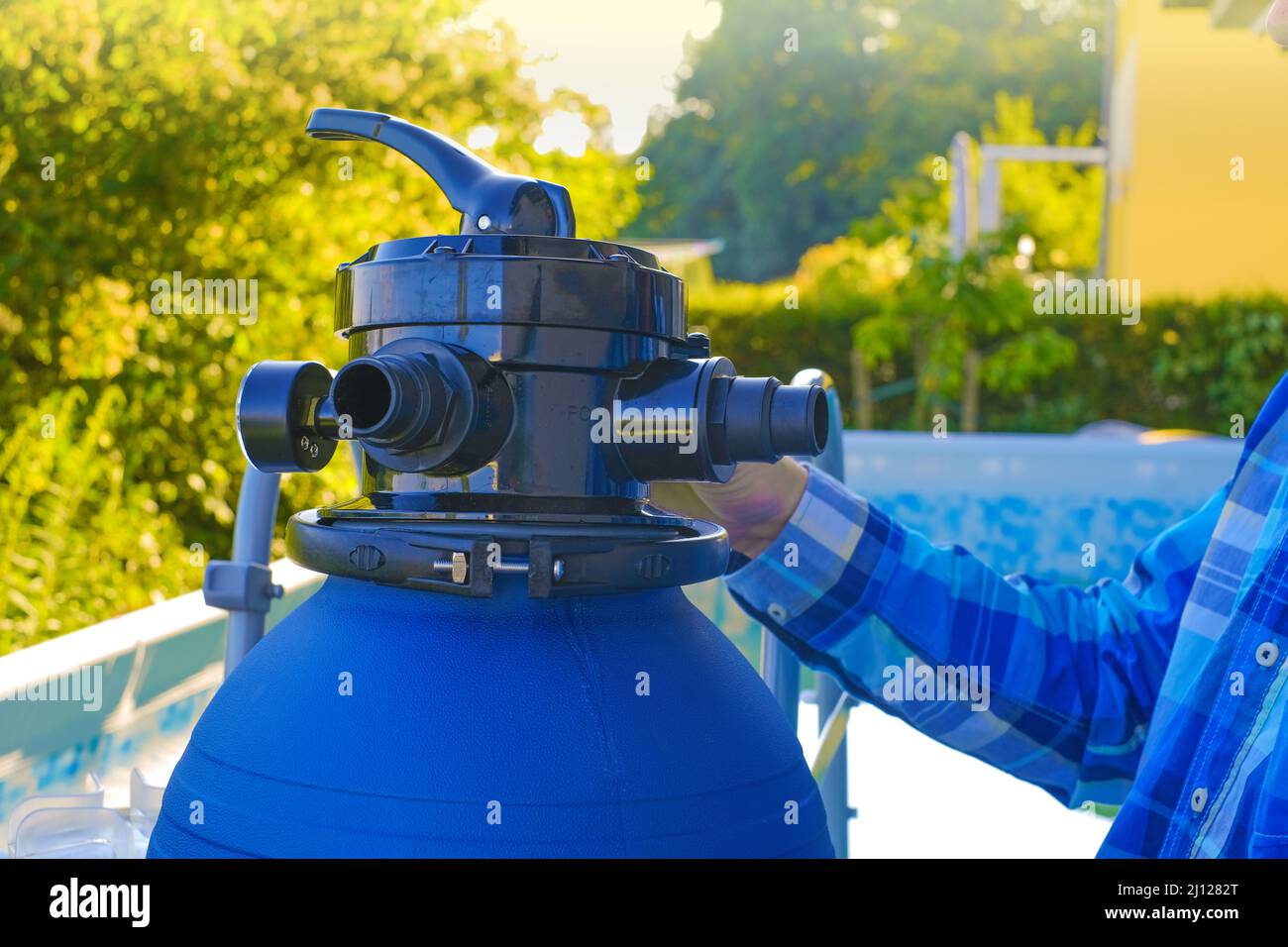 Swimming pool Filter.Swimming pool cleaning equipment. Blue water