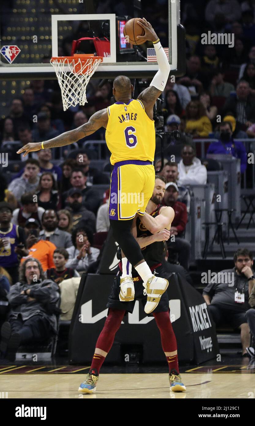 Cleveland, United States. 21st Mar, 2022. Los Angeles Lakers LeBron James (6) dunks over Cleveland Cavaliers Kevin Love (0) at Rocket Mortgage FieldHouse in Cleveland, Ohio on Monday, March 21, 2022. Photo by Aaron Josefczyk/UPI Credit: UPI/Alamy Live News Stock Photo