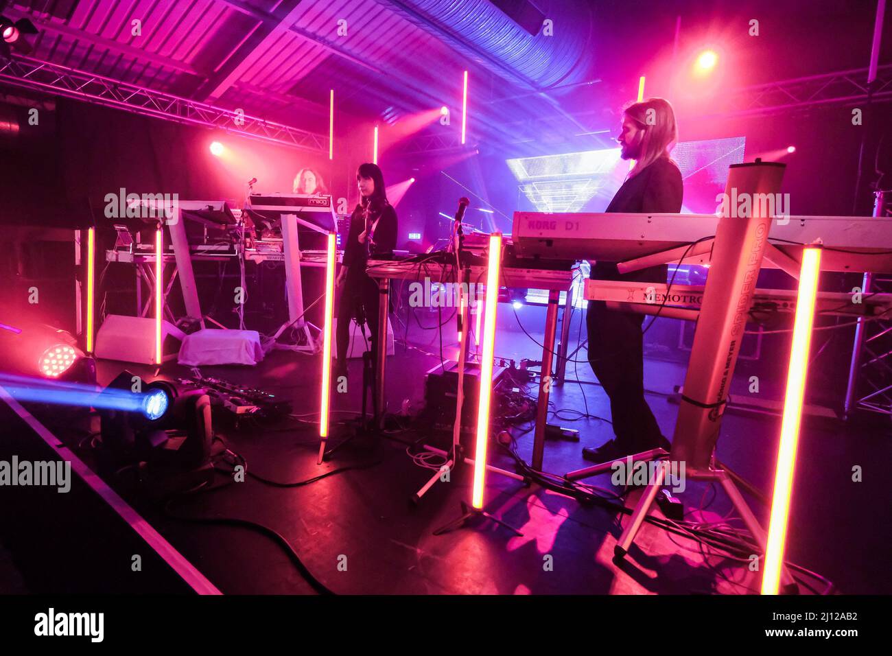 Southampton, UK. 21st Mar, 2022. L-R Thorsten Quaeschning, bandleader and Yamane Hoshiko, Japanese born violinist, and Paul Frick on stage with German electronic band Tangerine Dream founded in 1967, performing live at the Engine Rooms, Southampton. Credit: SOPA Images Limited/Alamy Live News Stock Photo