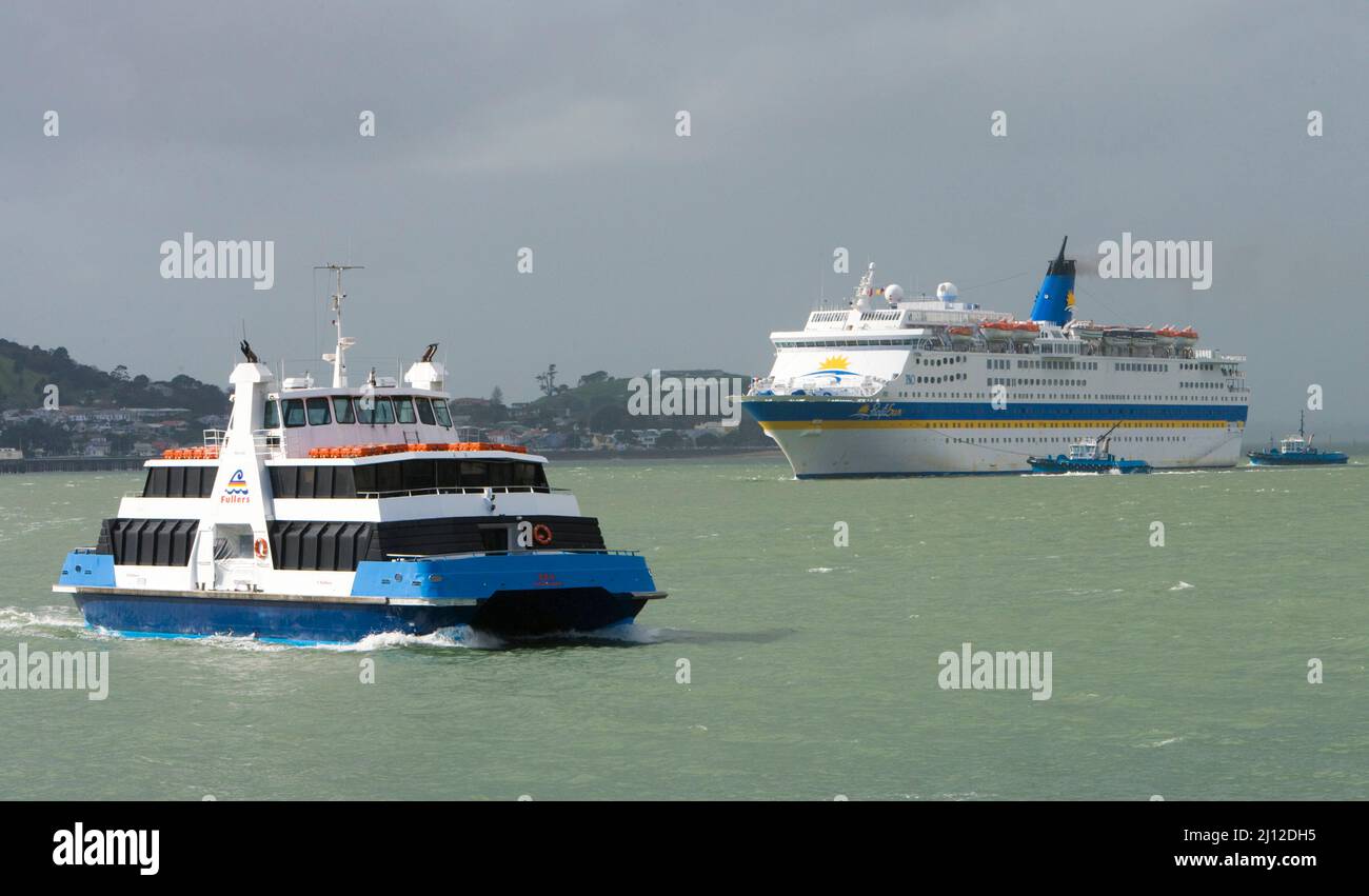 The Devonport Ferry crosses the path of the cruise ship, Pacific Sun, as she returns to port after her pacific cruise, Auckland, New Zealand,  Friday, Stock Photo