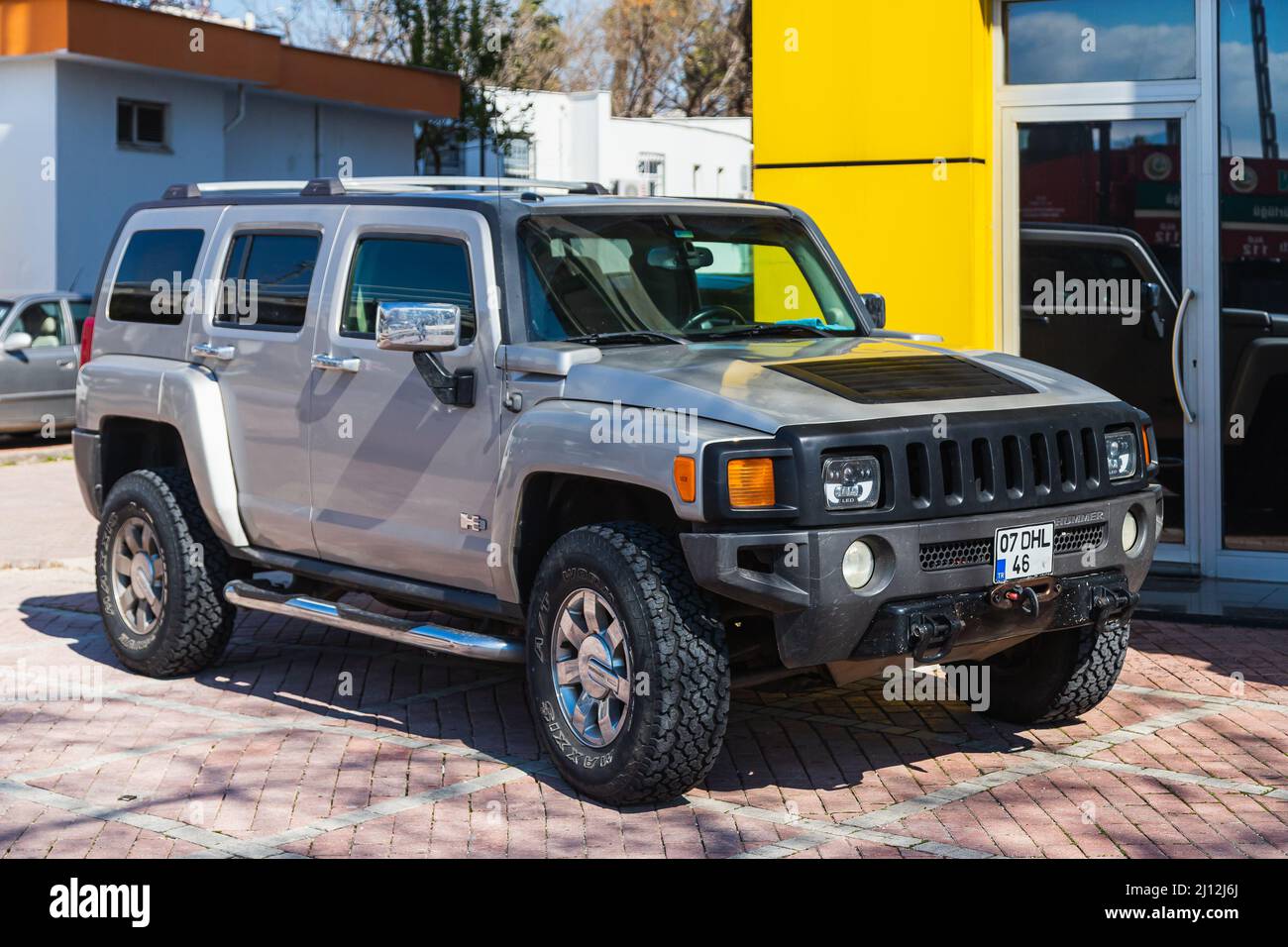Antalya; Turkey – March 04 2022:  silver Hummer H3 is parked  on the street on a warm summer day Stock Photo