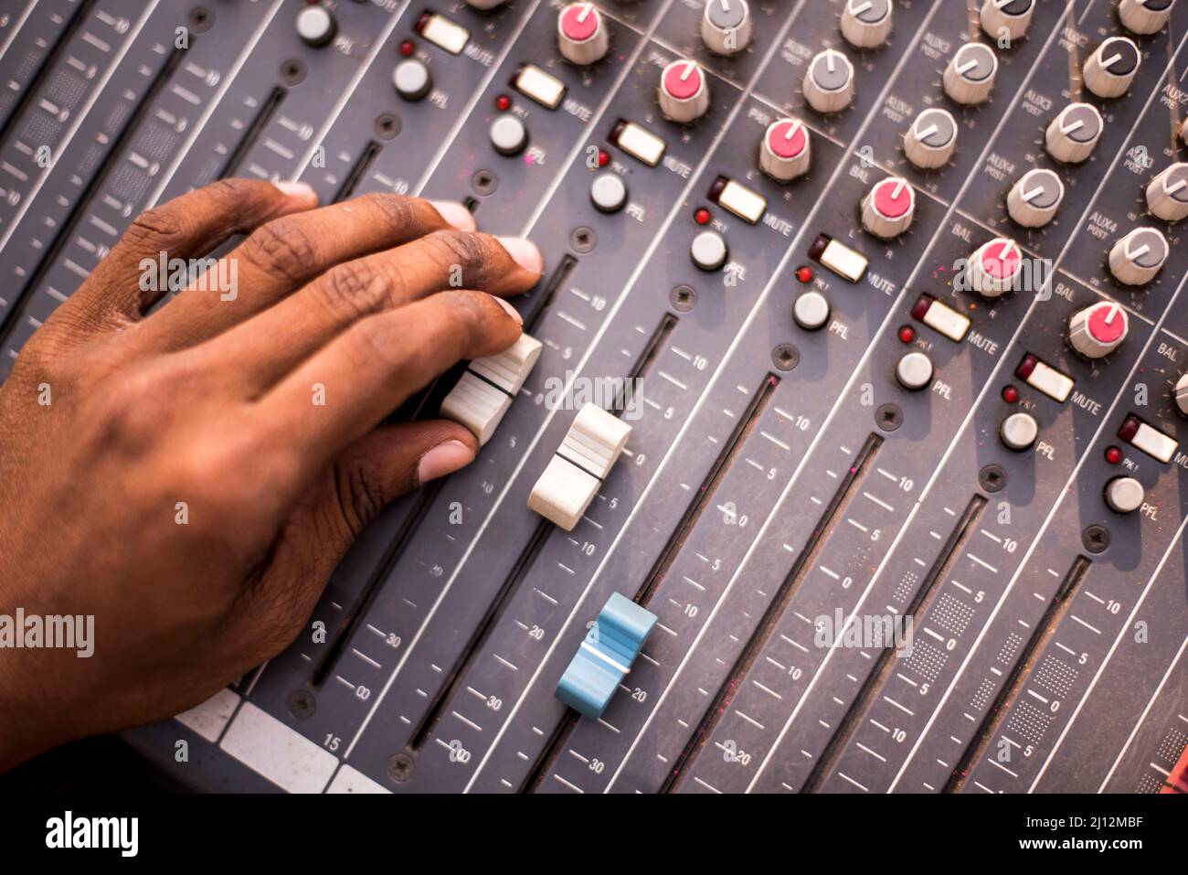 Adjusting audio in a sound mixer control panel Stock Photo Alamy