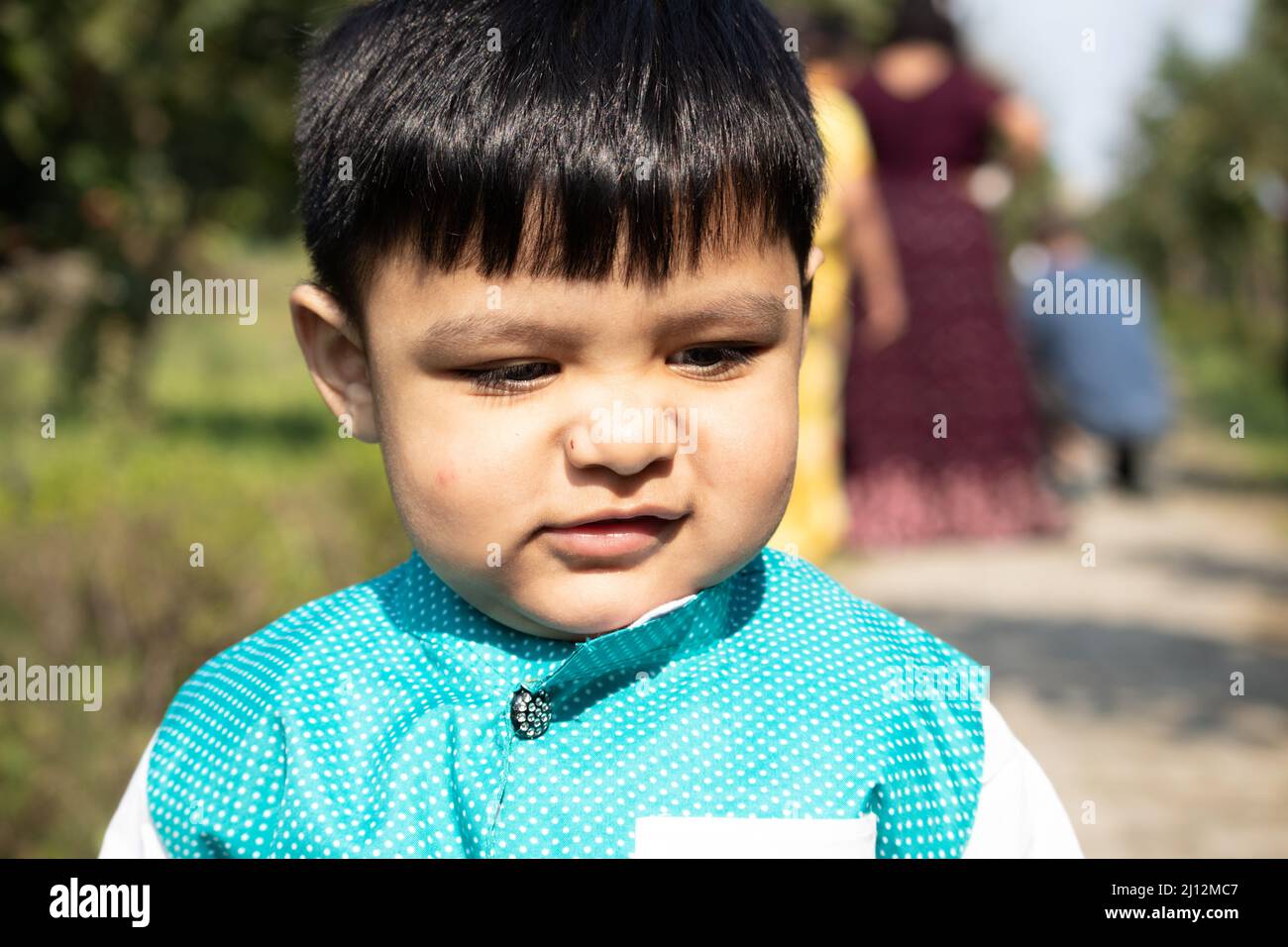 Portrait Of Young Indian Toddler Boy In Ethnic Indian Dress With Funny Expression On Face Stock Photo