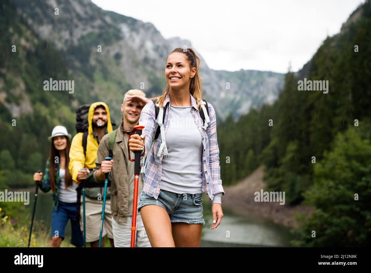 Group of happy hiker friends trekking as part of healthy lifestyle