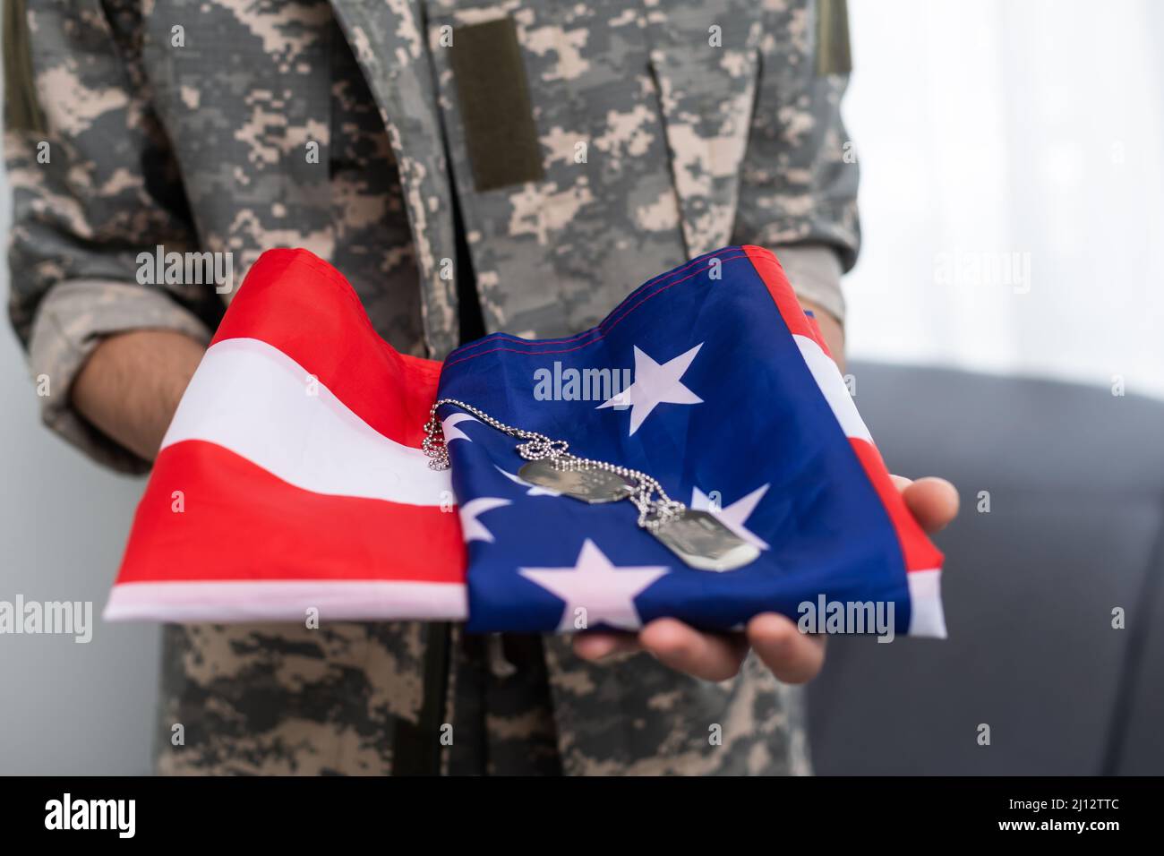 Military dog tags on american flag Stock Photo - Alamy