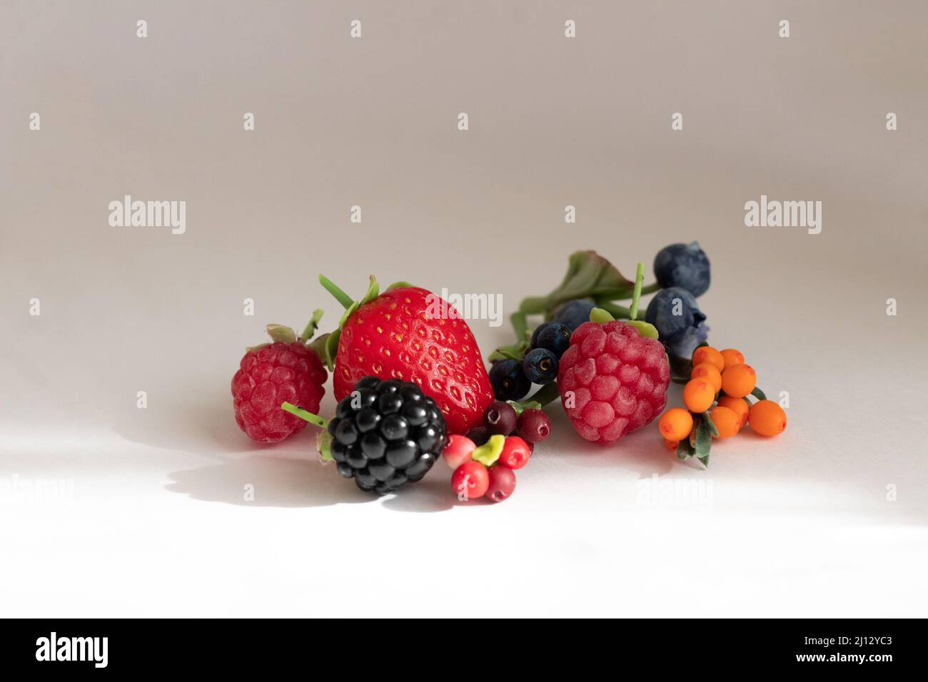 Miniature figures of strawberries, blackberries, raspberries, blueberries, blueberries, cranberries and cranberries Stock Photo