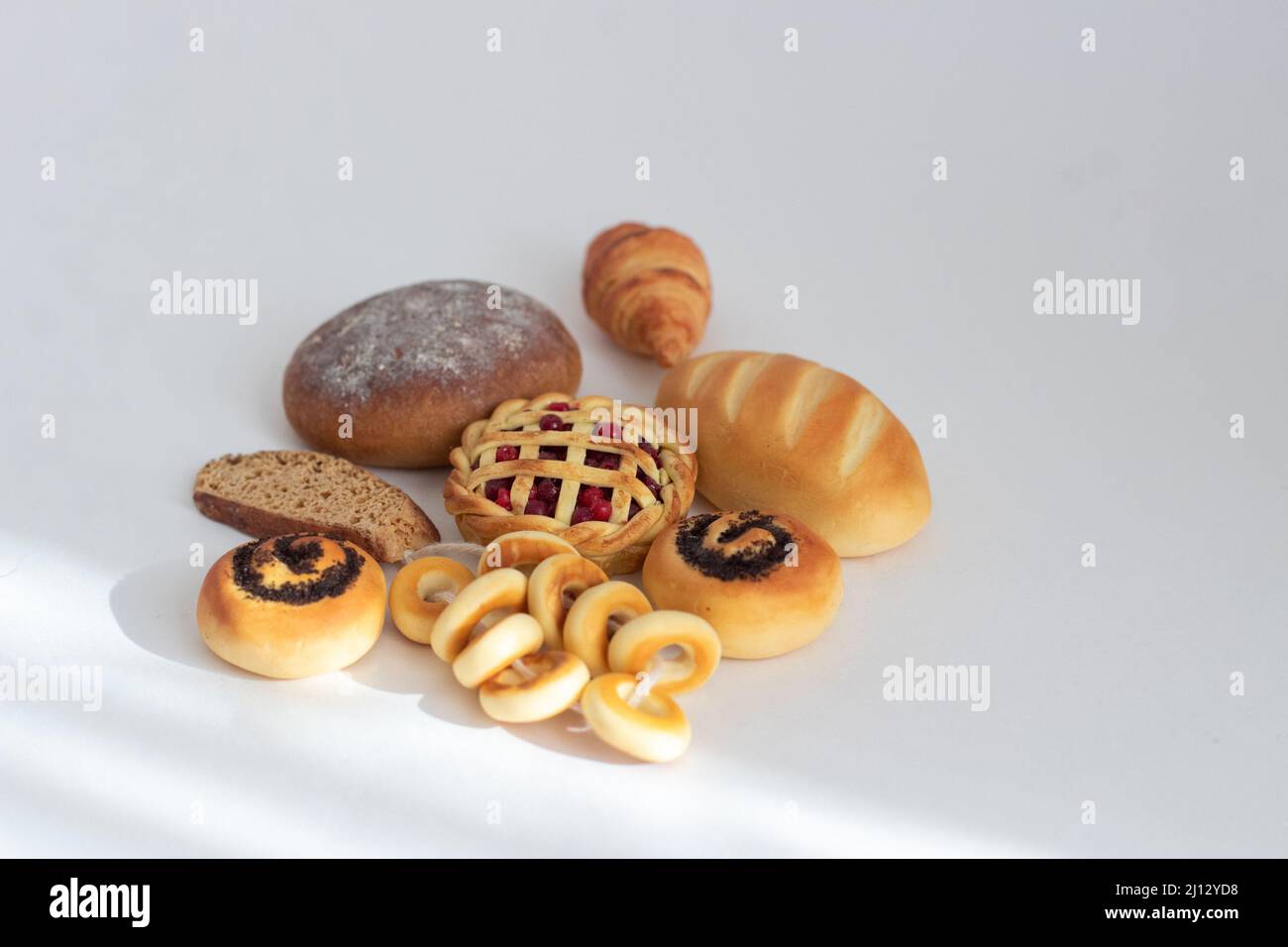 Miniature of bakery pastries in close-up on an isolated background ...