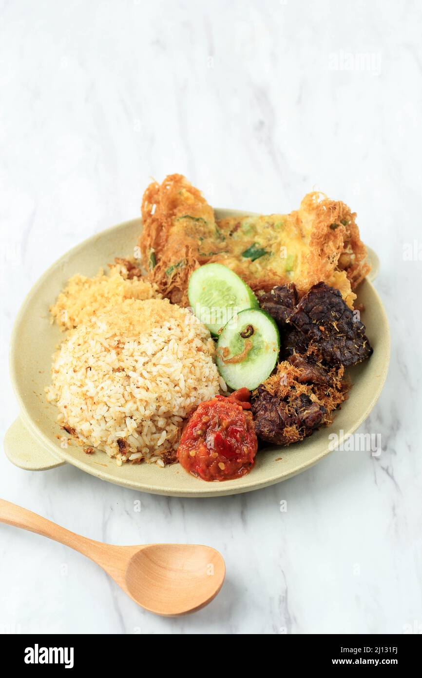 Nasi Campur Buk Madura with Paru (Cow Lung) and Serundeng (Shredded Coconut). Close Up Stock Photo