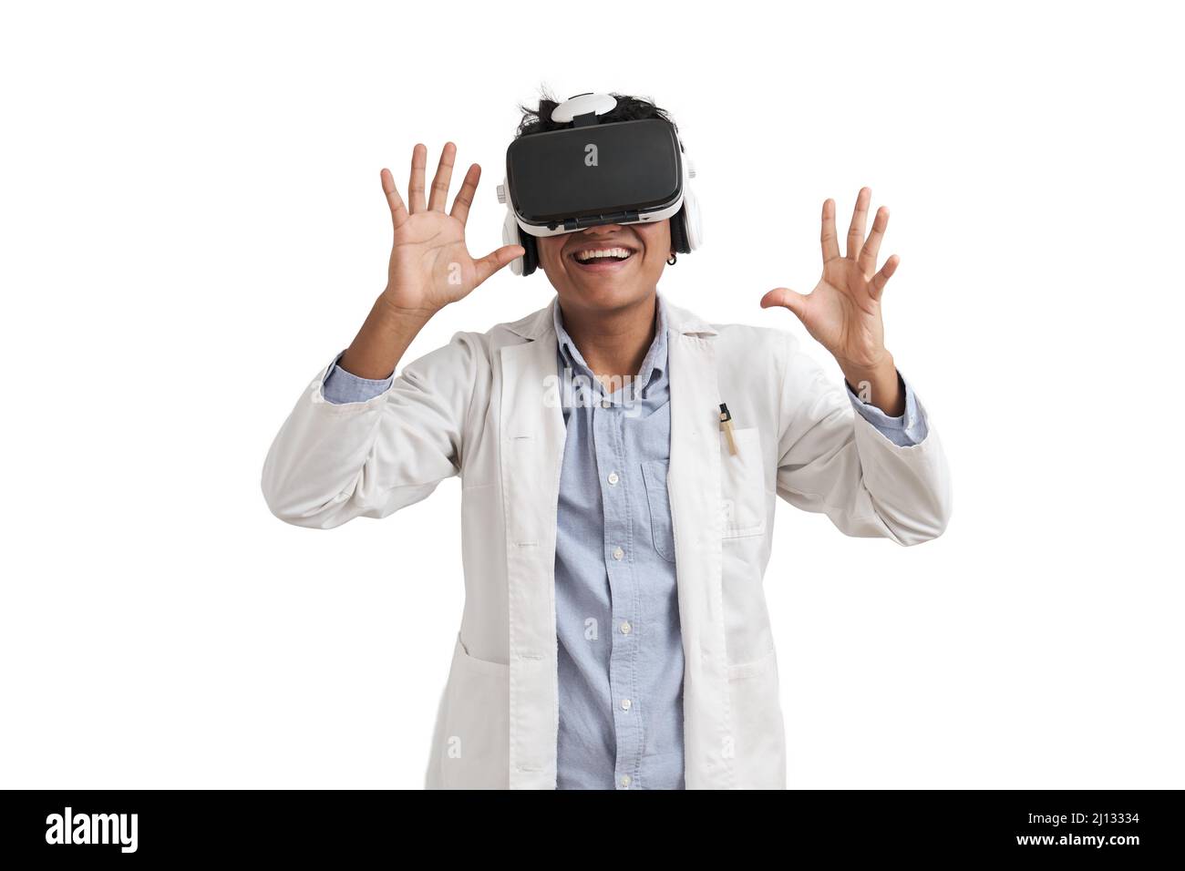 Young peruvian male scientific using virtual reality headset, isolated. Stock Photo