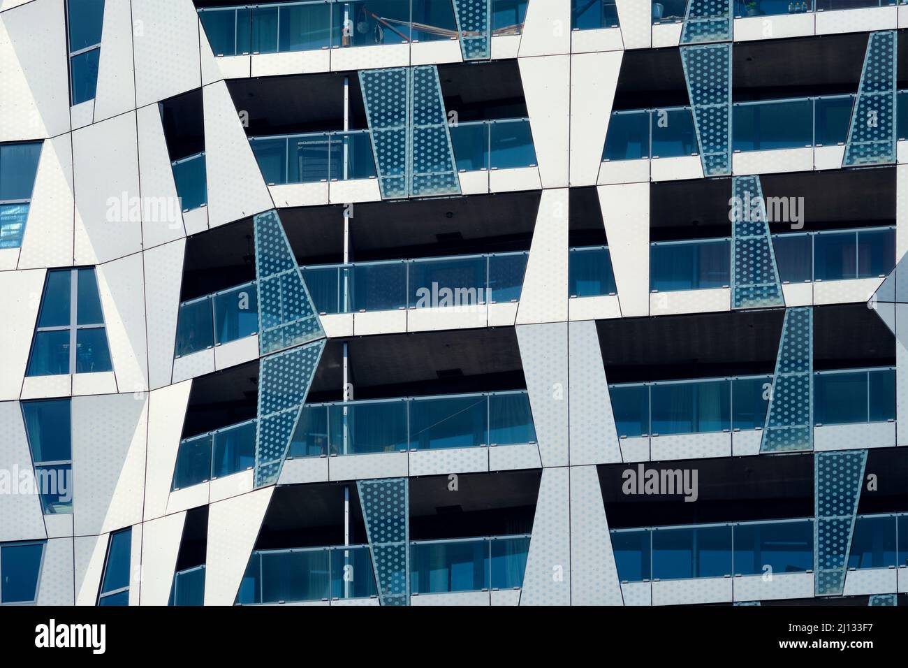 Modern residential building facade with windows and balconies ...