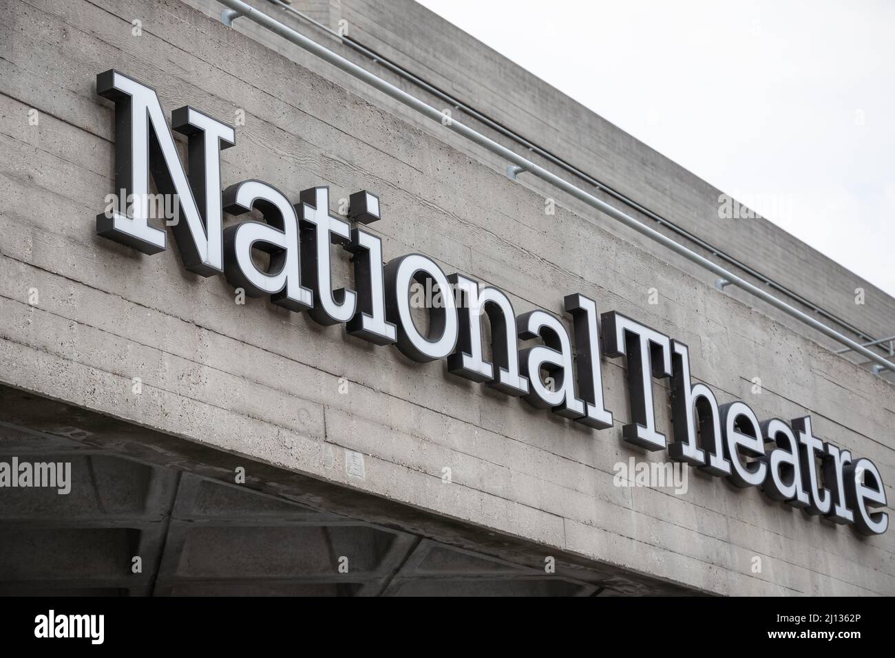 London, UK - July 19, 2021 - The signage and Brutalist architecture of the National Theatre in the South Bank area Stock Photo