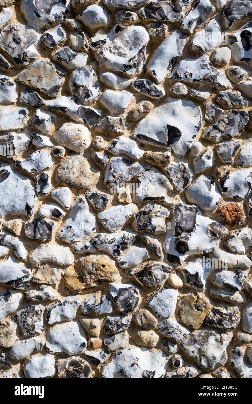 A flint wall in Norfolk - a typical local building material. Stock Photo