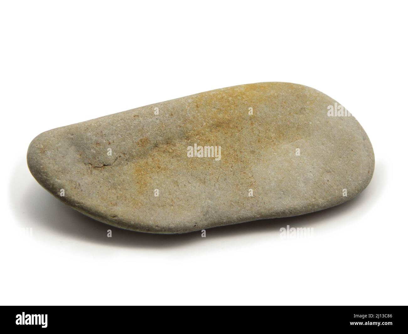 Pebble from the coast. Coast of the Caspian Sea. Close-up. Isolated on white background. Stock Photo