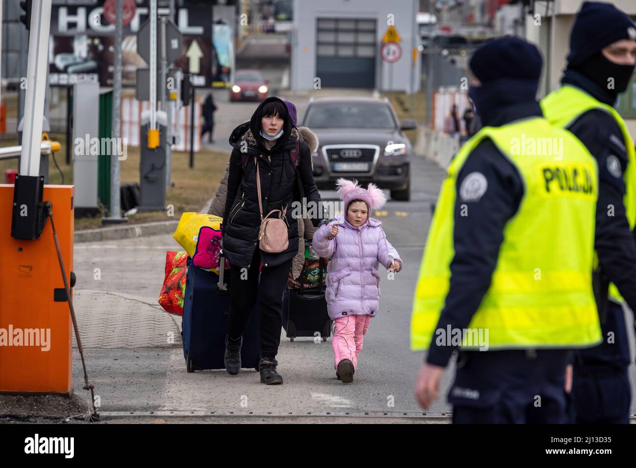 Arrival of refugees from Ukraine at the Polish-Ukrainian border crossing in Medyka. Here the refugees are provided with warm food and clothing. From here, they are forwarded by bus to large sites or collective shelters. Foreign helpers also offer trips to other European countries. Stock Photo