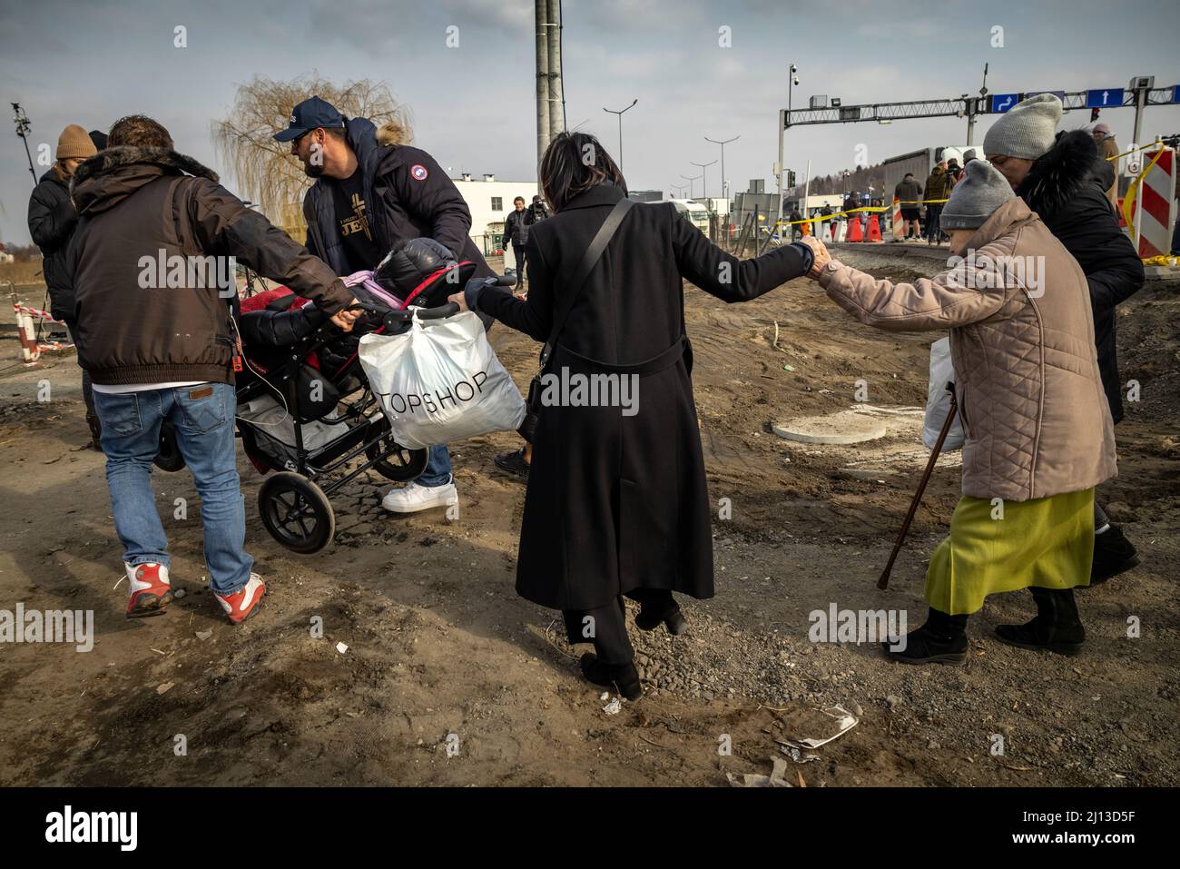 Arrival of refugees from Ukraine at the Polish-Ukrainian border crossing in Medyka. Here the refugees are provided with warm food and clothing. From here, they are forwarded by bus to large sites or collective shelters. Foreign helpers also offer trips to other European countries. Stock Photo