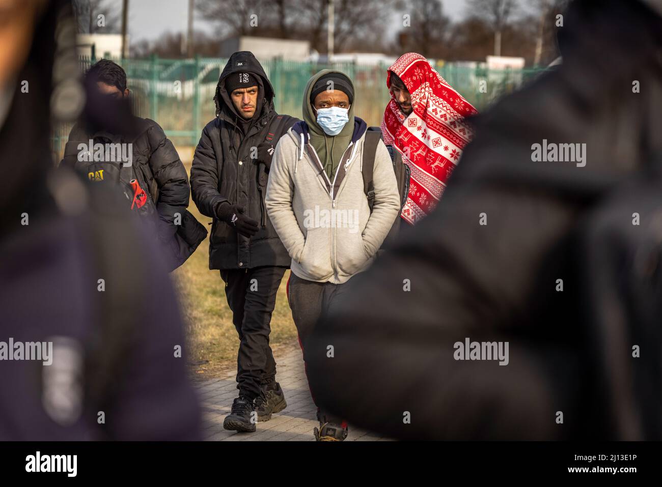 Arrival of PUC refugees from Ukraine at the Polish-Ukrainian border crossing in Medyka. People without Ukrainian passports were processed separately. In long lines and bitter cold, they had to wait for days to enter Poland. On the Polish side, however, their onward journey was delayed by buses to large sites or collective shelters. Stock Photo