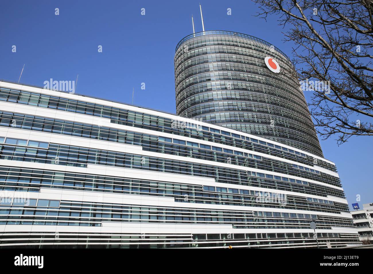 Düsseldorf (Vodafone campus) - March 9. 2022: View on modern office building complex with high tower against clear blue sky Stock Photo