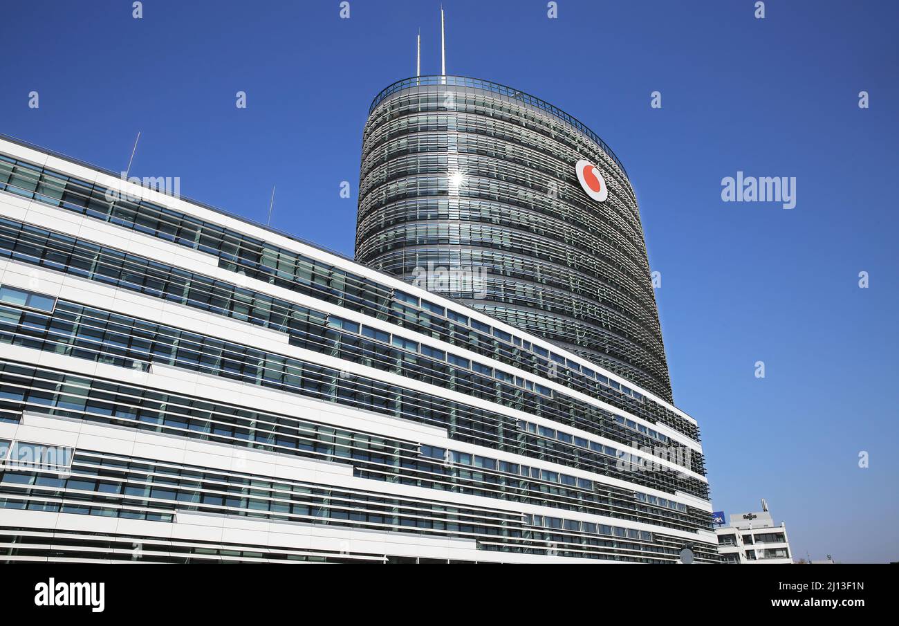 Düsseldorf (Vodafone campus) - March 9. 2022: View on modern office building complex with high tower against clear blue sky Stock Photo