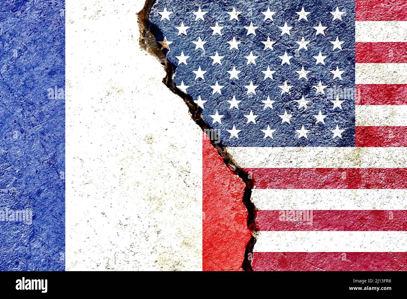 France vs USA national flags isolated on cracked dirty wall background