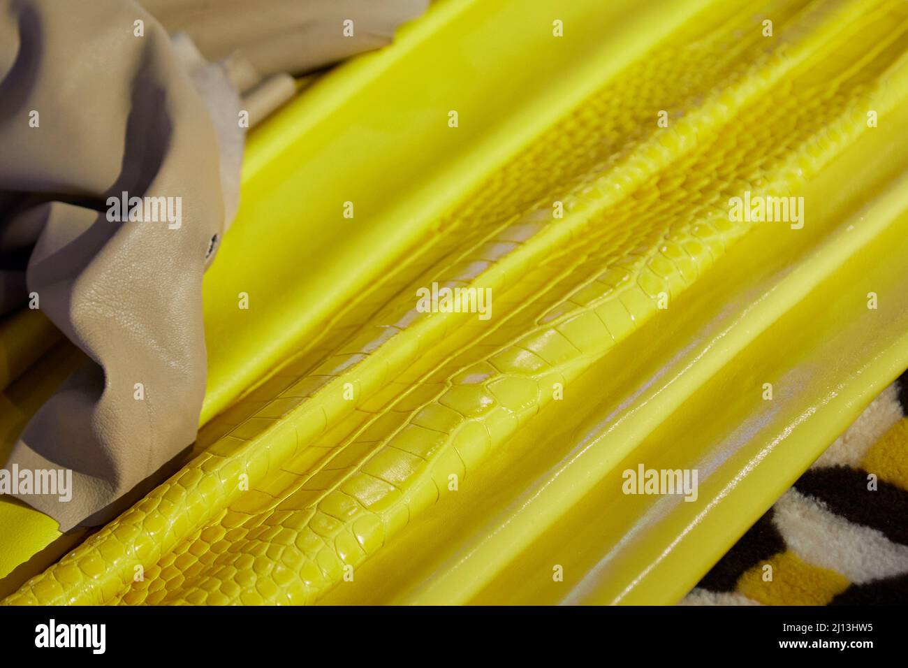Yellow and beige leather samples texture background Stock Photo