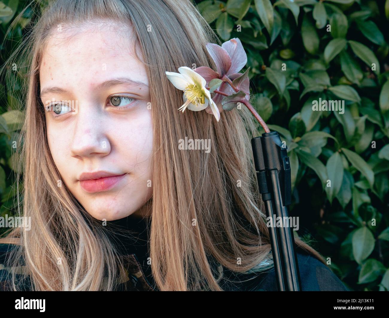 caucasian blond young teen ager soldier girl on a checkpoint holding a ...
