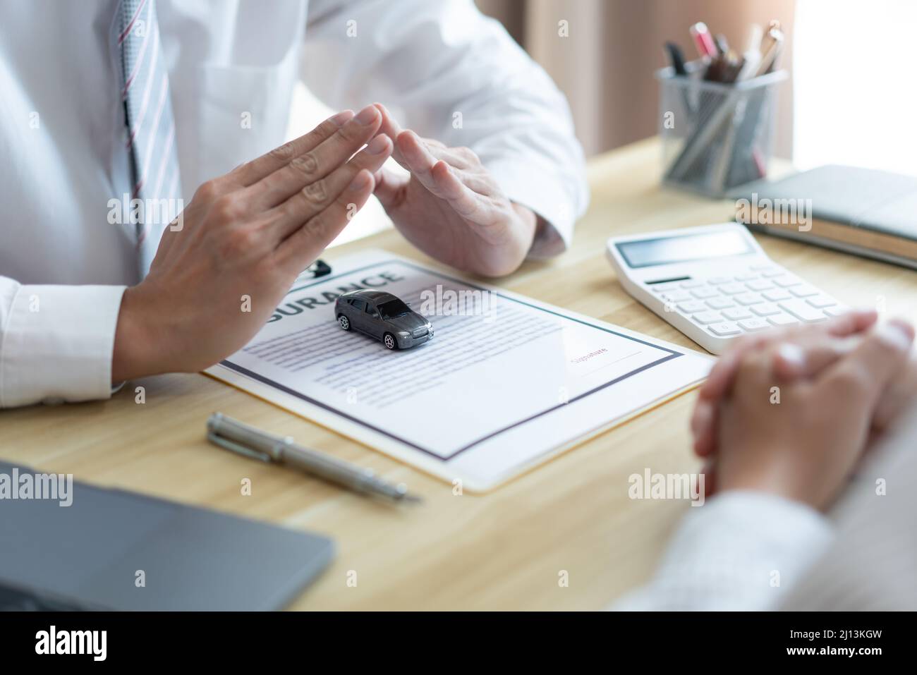 Insurance concept the car merchant presenting the function and