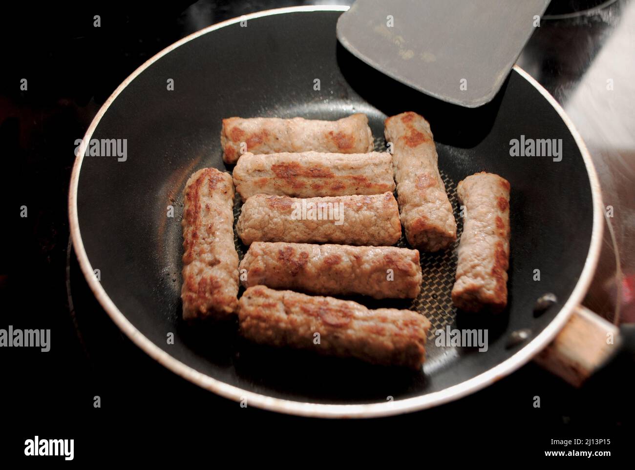 Breakfast Sausage Links Frying in a Pan Stock Photo