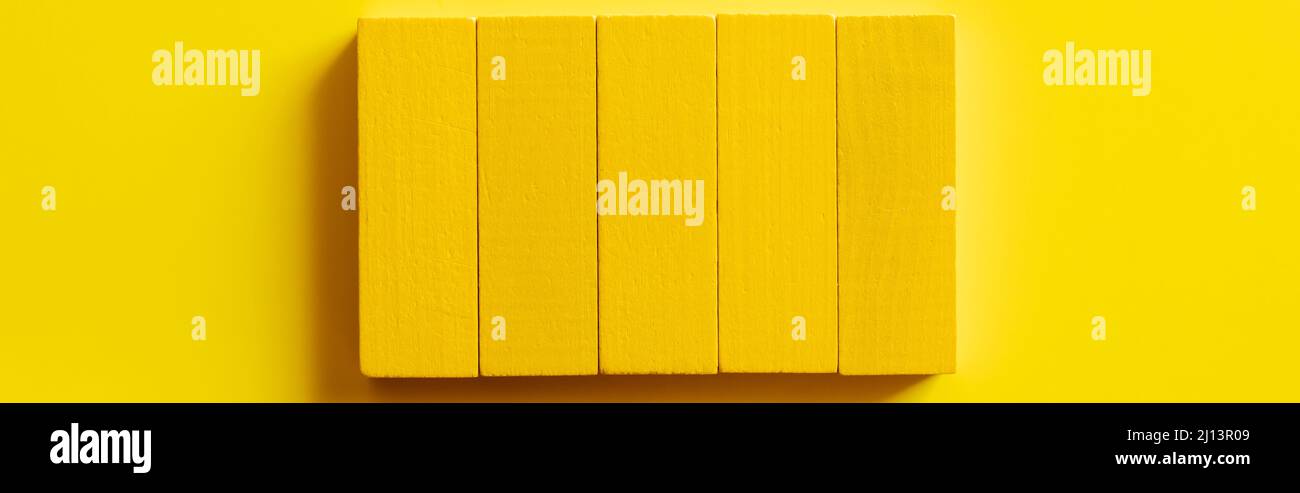 Yellow Rectangular Blocks top view of bright rectangular blocks on yellow background, banner ...