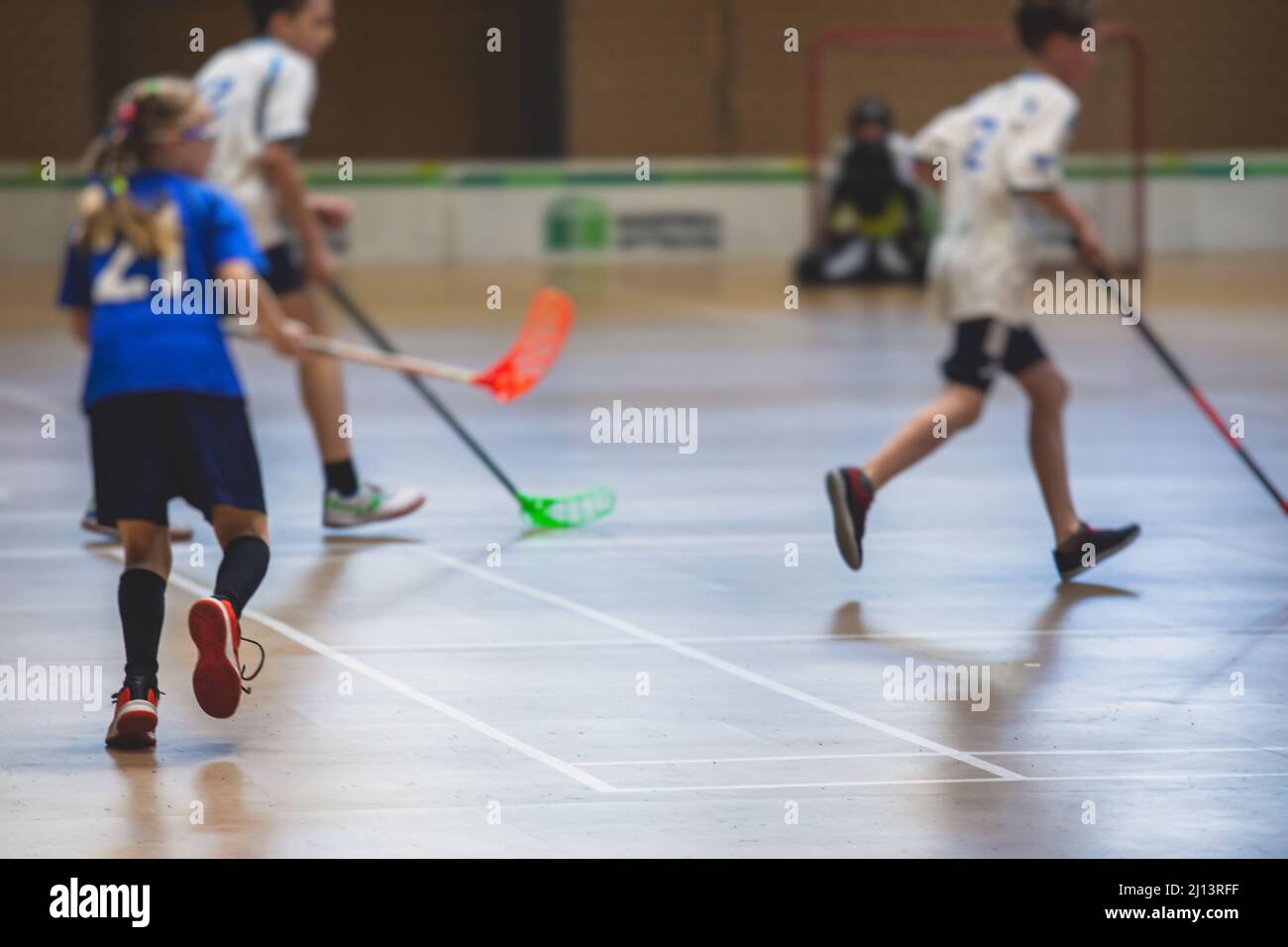 View of floorball match game, court hall indoor venue with junior