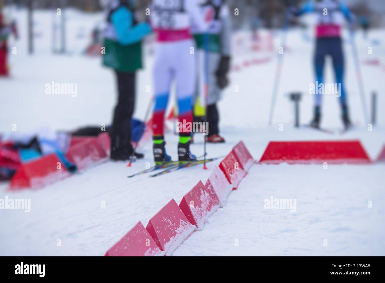 Alpine skiing race slalom competition, athletes ready to start ski competitions on a piste slope