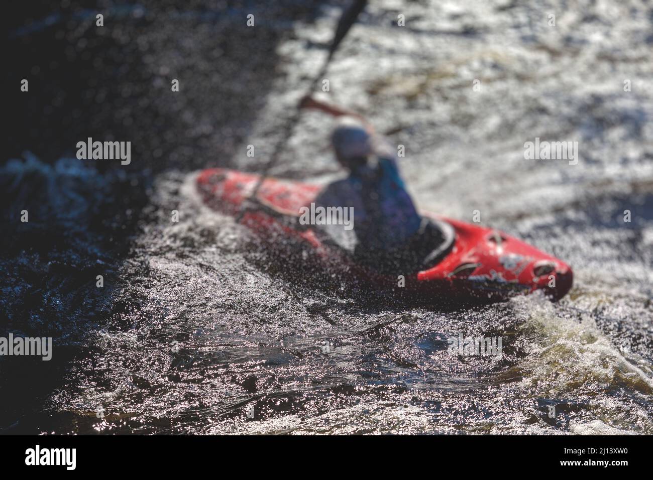 Kayak slalom canoe race in white water rapid river, process of kayaking