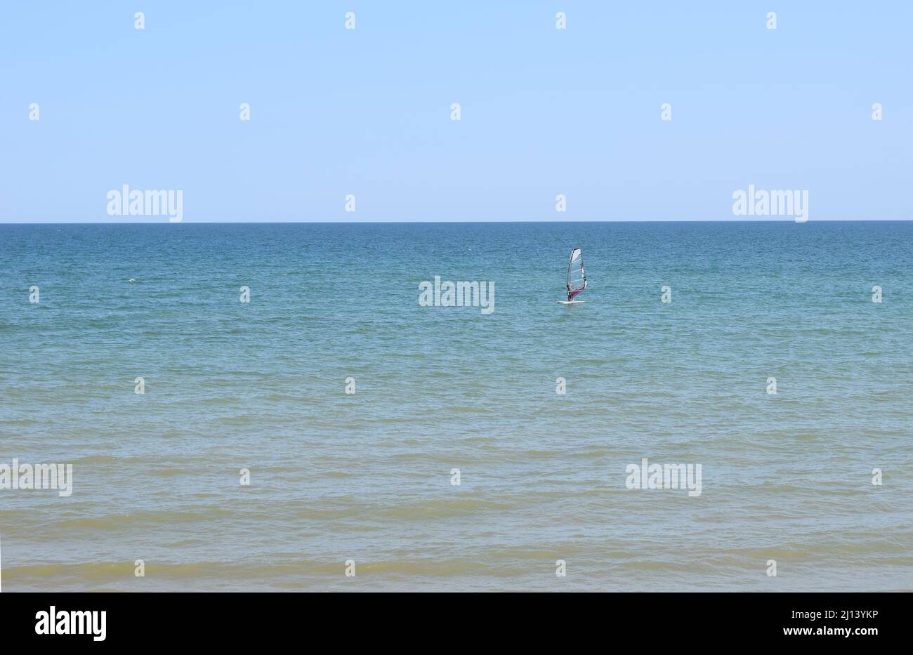 Windsurfing During a Windy Day with a Very Rough Sea. Azov sea, Russia - July 25.2021 Stock Photo