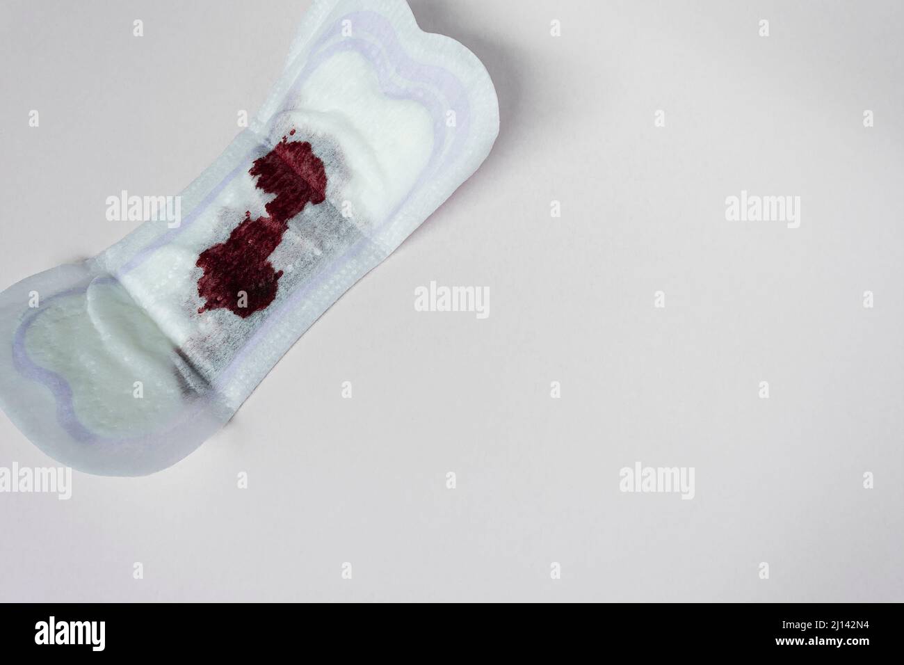 Menstrual blood on a sanitary pad. Woman hygiene protection. Copy space  pattern. Directly above and flat lay Stock Photo - Alamy