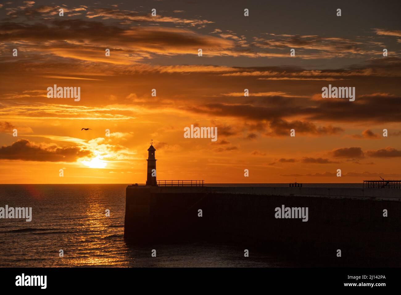 Ramsey harbour breakwater at sunrise, Isle of Man Stock Photo