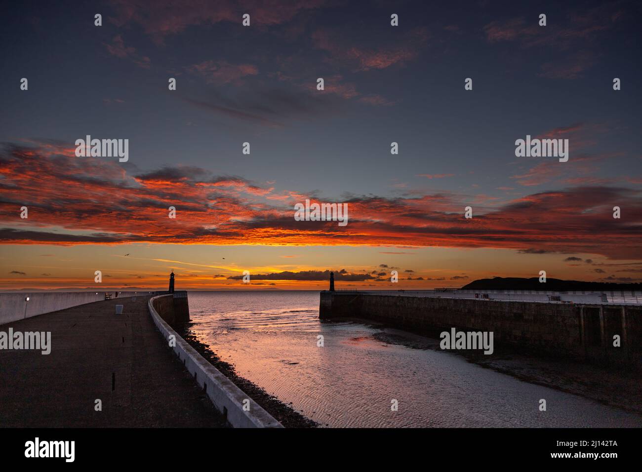 Ramsey harbour breakwater at dawn, Isle of Man Stock Photo