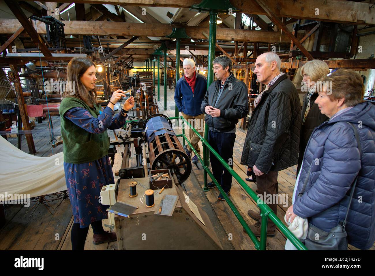 Demonstration relating to silk weaving at Paradise Mill, Macclesfield in Cheshire, England. Stock Photo