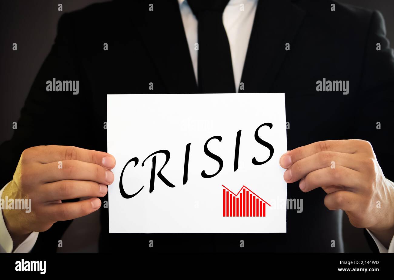 man hands pressing the word crisis, in black and white Stock Photo - Alamy
