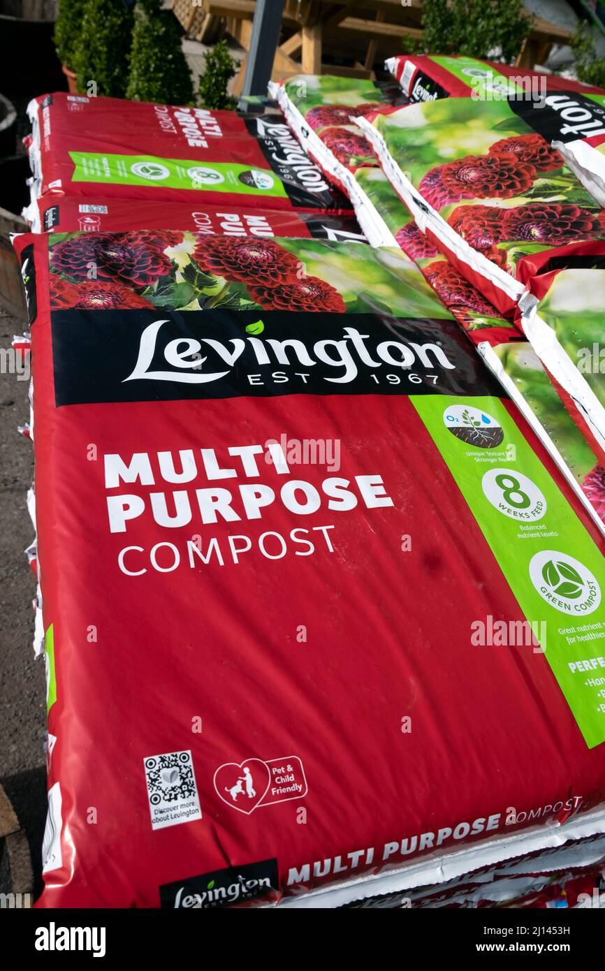 Plastic bags of Levington Multi Purpose compost for sale at a garden