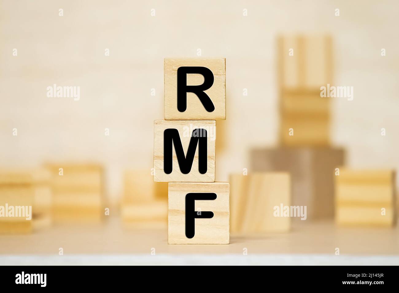 Wood block word RMF and coins with copy space using as background business financial, saving money, retirement concept. Stock Photo