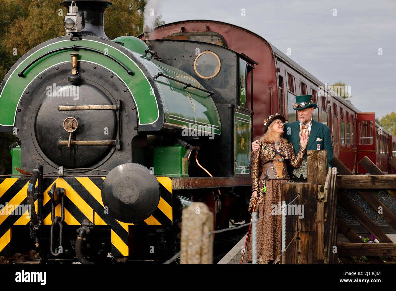 Couple in front of  Steam Train at Rowsley Peak District Derbyshire UK Stock Photo